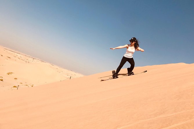 Abu Dhabi Desert Safari With BBQ Dinner,Sandboarding & Camel Ride - Pickup and Drop-off
