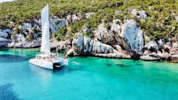 Alghero: Full Day on a Catamaran in Porto Conte Natural Park - Duration and Pricing