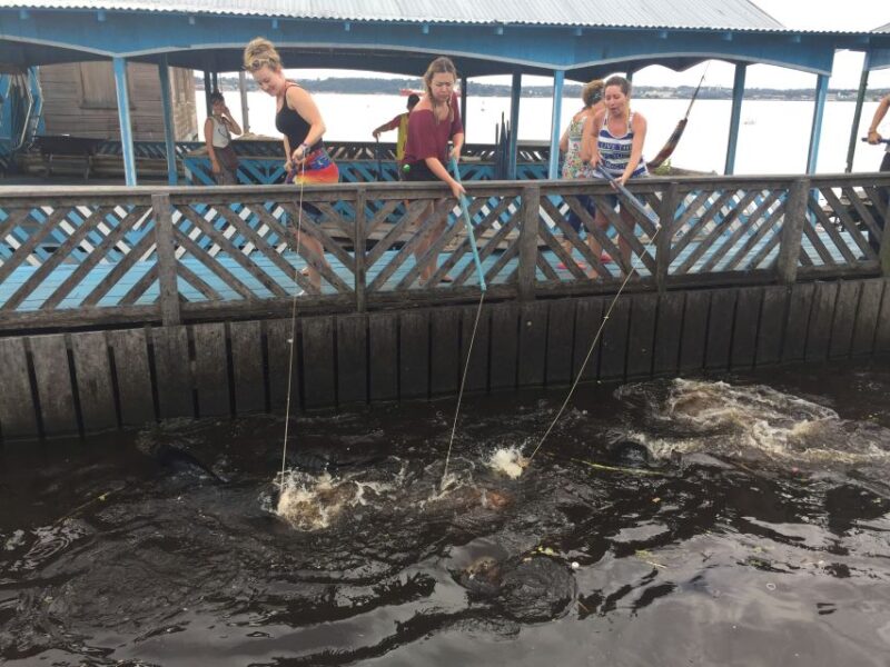 Amazonas: Boat Ride With a Local Amazonian - Interaction With Pirarucu Fish