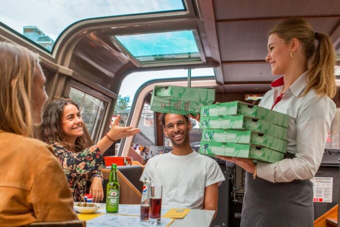 Amsterdam: Evening Canal Cruise With Pizza and Drinks - Savoring the Pizza and Drinks