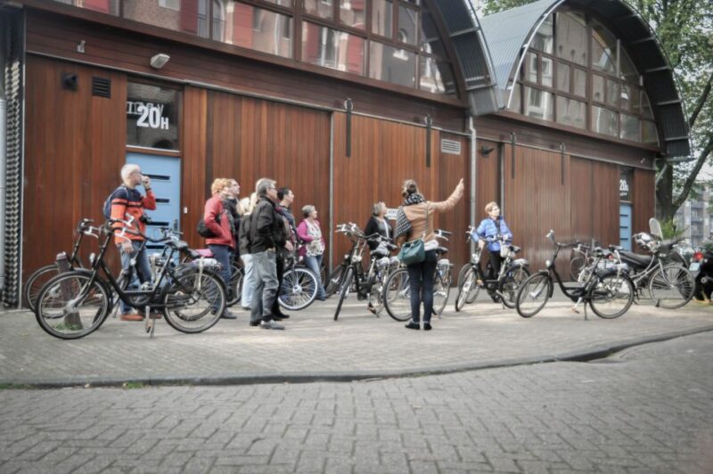 Amsterdam: Guided City Bike Tour in French - Price and Duration