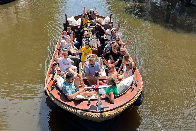 Amsterdam Luxury Boutique Boat Tour With Unlimited Beer and Wine - Guided Experience