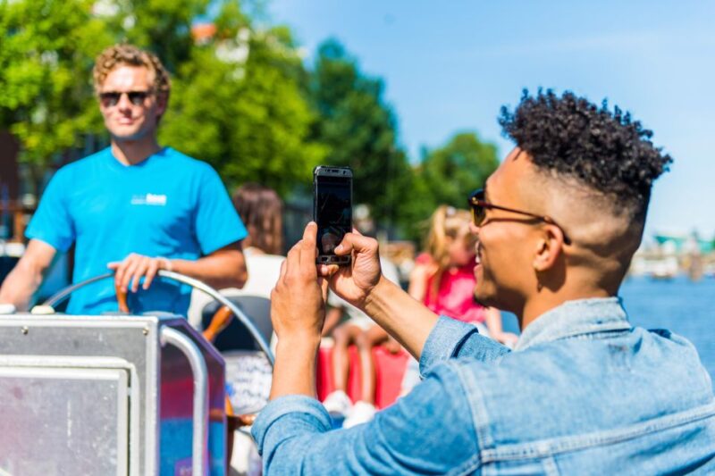 Amsterdam: Open Boat Canal Cruise With Local Guide - Pricing and Booking Information