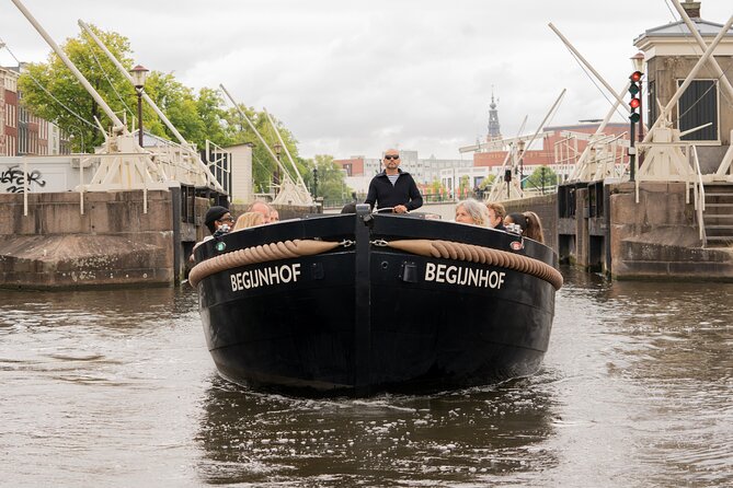 Amsterdam Open Boat Evening Canal Tour Local Guide and Open Bar - Tour Specifics