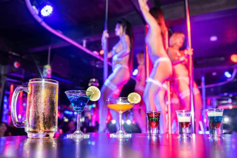 Amsterdam: Red Light Rendezvous, Striptease Show and Dinner - Pricing and Reservations