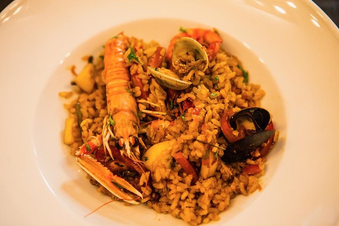 An Interactive Market Tour and Fun Paella Class in Barcelona - Booking Requirements and Policies