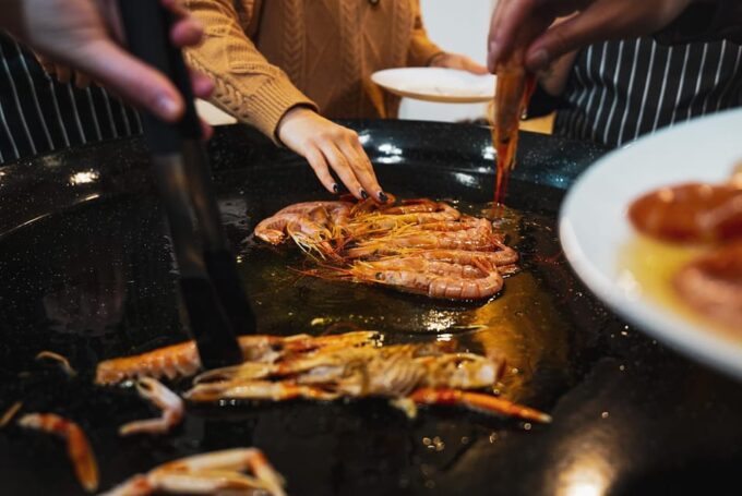 Barcelona: Seafood Paella Cooking Class & Boqueria Market - Cooking With a Professional Chef