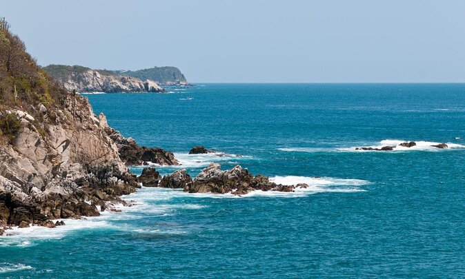 Bays of Huatulco and Snorkeling on a Double Decker Catamaran - Key Points