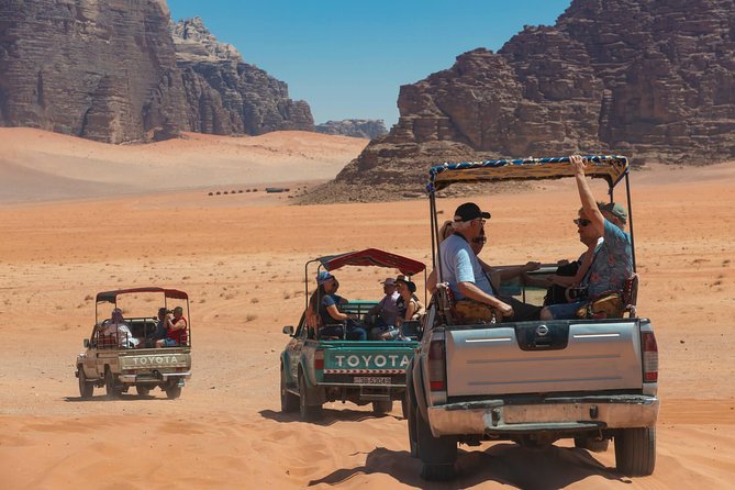 Best of Wadi Rum | Full Day Jeep Tour + Sleep Under the Stars | Pack All-In - Traversing the Red Sand Dunes