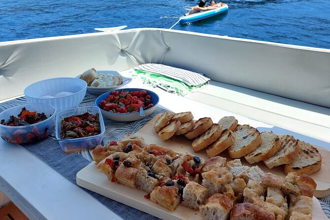 Boat Trip With Lunch or Aperitif in Procida With Eraora Boat - Onboard Activities