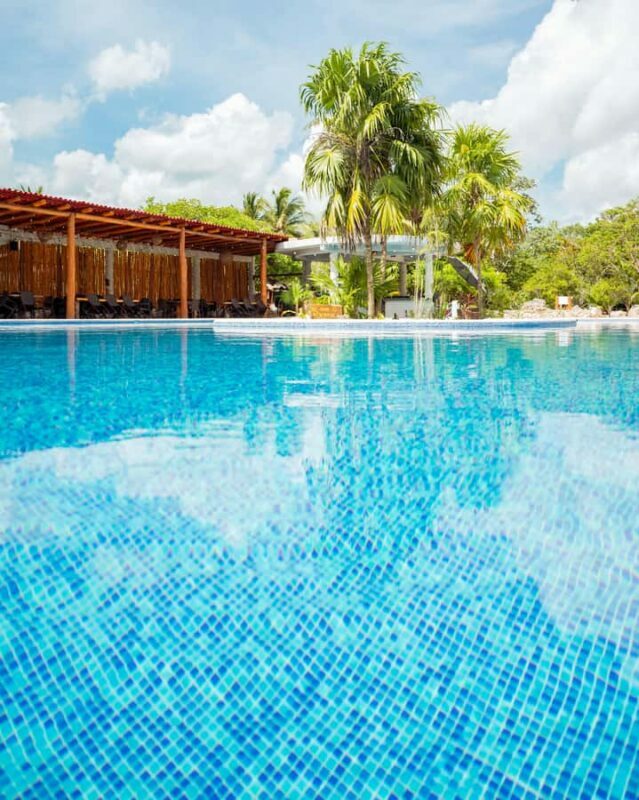 Cancun: Cenotes El Retoño entrance with transport, food, and guided tour. - Key Points