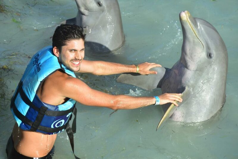 Cancun: Dolphin Encounter on Isla Mujeres and Garrafon Park - Cancellation Policy and Languages