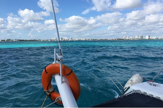 Catamaran to Isla Mujeres, Open Bar, Buffet, Beach Club Included - Booking Information