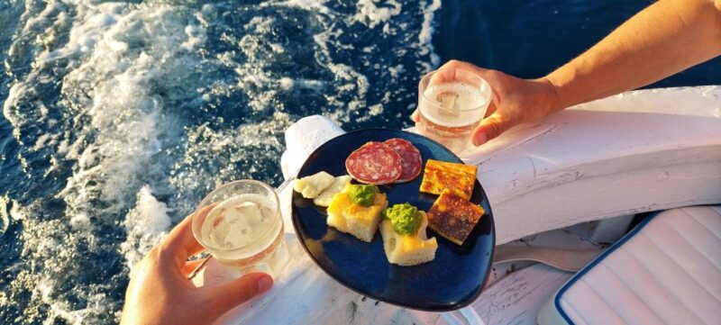 Cinqueterre Sunset Boat Tour on a Traditional Ligurian Gozzo - Key Points