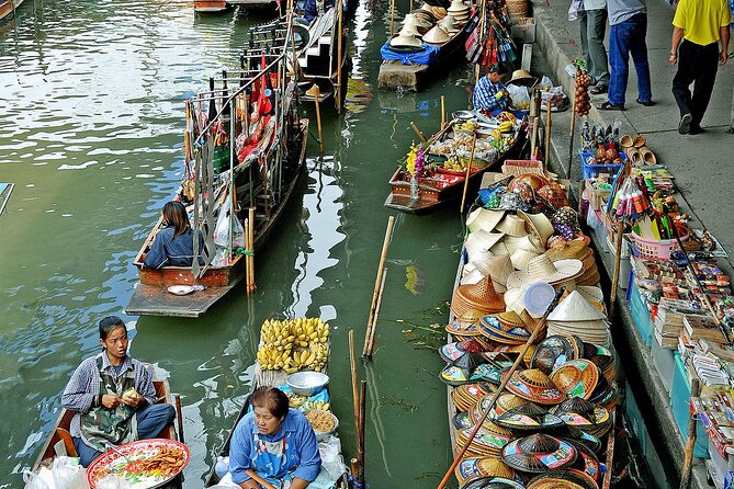 Damnoen Saduak Floating Market and Maeklong Railway Market Tour - Discovering Wat Bang Kung and Banyan Tree