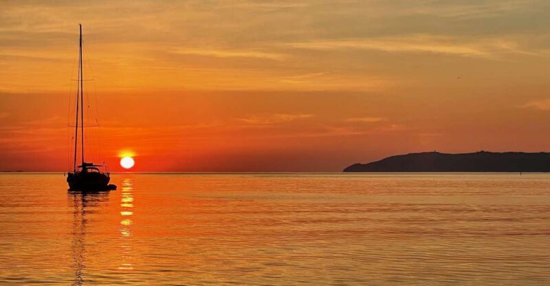 Departure From Hyères at Sea: Sunset by Sailboat - Sailing to the Cove