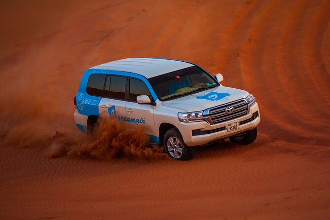 Dubai 4x4 Desert Safari, Quad Bike, Camel Ride & BBQ Dinner - Sandboarding and Camel Riding