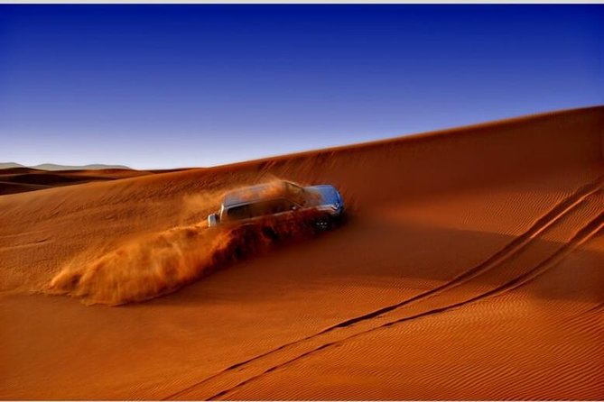 Dubai Desert Red Dune Half-Day Safari Adventure and BBQ Dinner - Camel Riding and Henna Painting