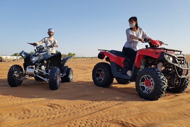 Dubai Desert Safari With BBQ, Quad Bike And Camel Ride - Sandboarding, Dune Bashing, and Camel Riding