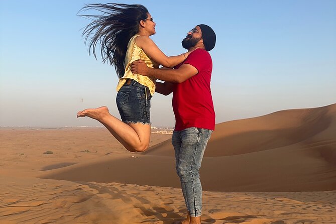 Dubai Desert Safari With Camel Ride Sand Board & BBQ Dinner - Sand Boarding and Camel Ride