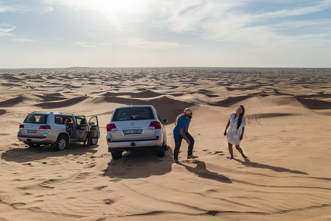 Dubai Red Dune Desert Safari, Camels, Sandboarding & BBQ Options - Camel Rides and Sandboarding