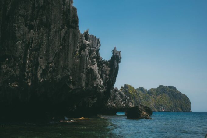 El Nido: Full-Day Premium Island Hopping Catamaran Cruise - Docking Area and Van Transfers