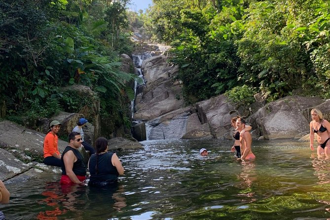 El Yunque: Waterslide, Waterfall, Shopping, and Beach Tour - Booking and Cancellation Policy