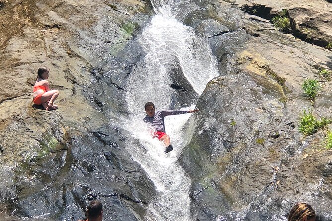 El Yunque: Waterslide, Waterfall, Shopping, and Beach Tour - Sightseeing in El Yunque National Park