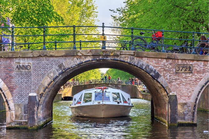 Experience Amsterdam Nightlife on Canal Cruise With Cheese & Wine - Highlights of the Nightlife Cruise Experience