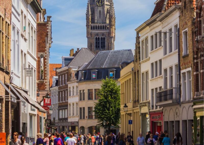 Experience the Best of Bruges on Private Tour With Boat Ride - Boat Ride Along Canals