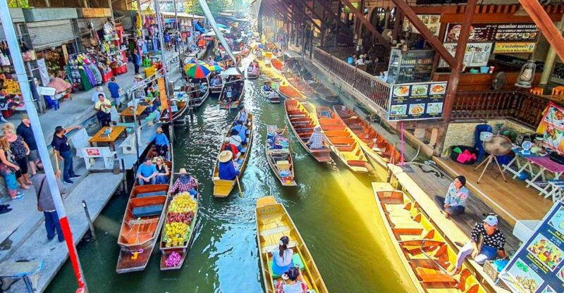From Bangkok: Damnoen Saduak & Train Market Tour in Spanish - Itinerary Details