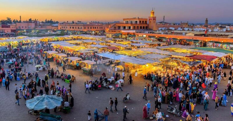 From Casablanca: Marrakech Guided Day Trip With Camel Ride - Atmosphere and Entertainment