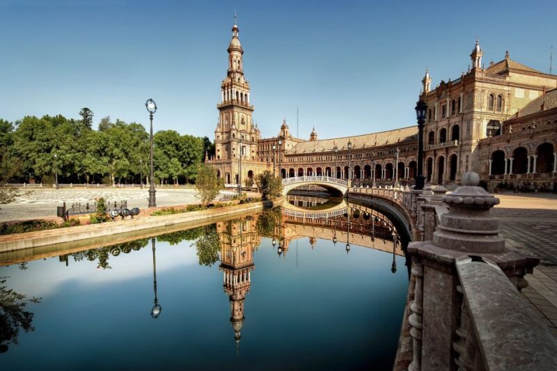 From Malaga: Seville Day Trip Guide Commentary on the Bus - Strolling Along the Guadalquivir River