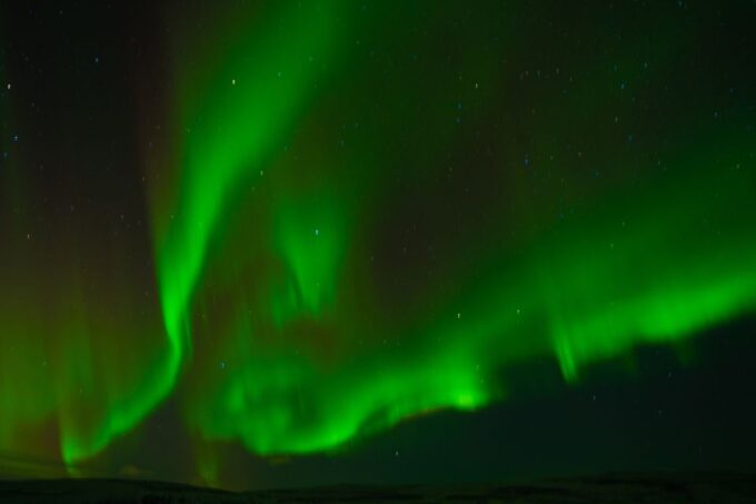 From Reykjavik: Northern Lights Guided Tour With Photos - Weather Conditions and Cancellations