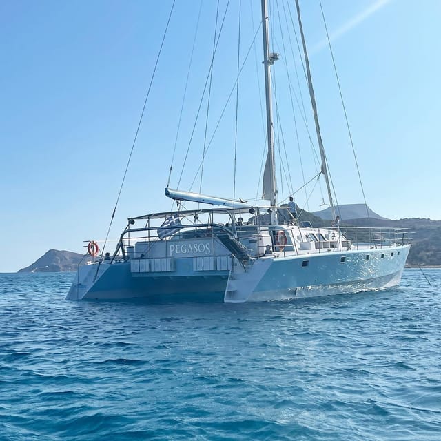From Rhodes: Half-Day Catamaran Cruise With Swim Stops - Onboard Activities and Experiences
