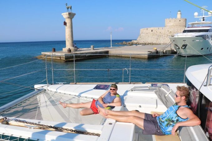 From Rhodes: Private Catamaran Cruise All Inclusive - Hotel Pickup and Dropoff