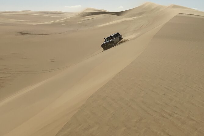From Siwa: Sunset Desert Safari, Sand-board, Hot Spring & Dinner at Desert Camp - Inclusions