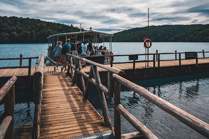 From Split: Self-Guided Plitvice Lakes Day Tour With Boat Ride - Scenic Boat and Train Rides
