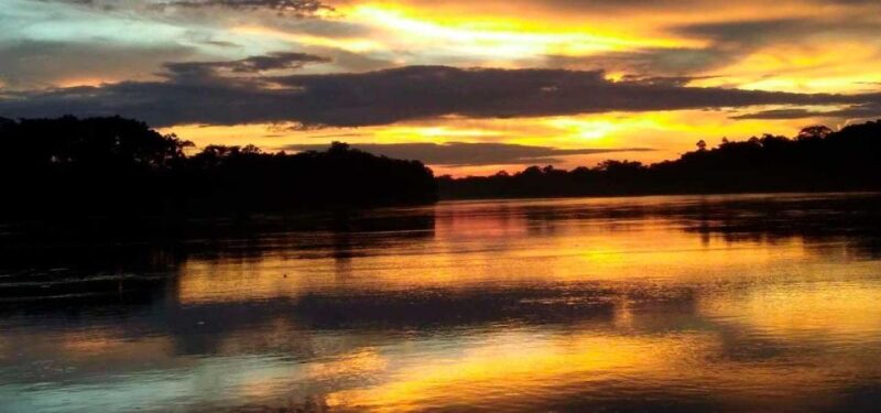 From Tambopata: Sunset on the Tambopata River - Highlights of the Tour