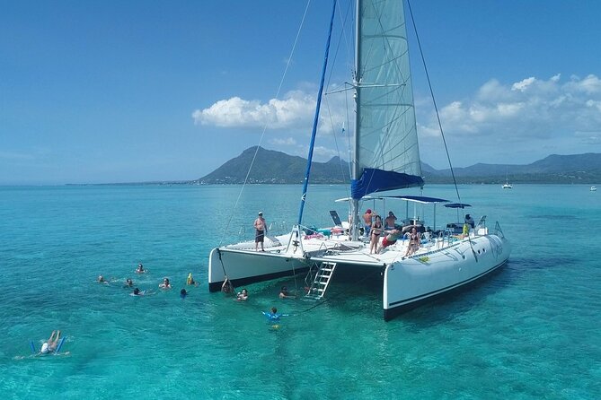 Full Day Catamaran Cruise on Shared Basis to Bénitiers Island - Pricing and Booking Details