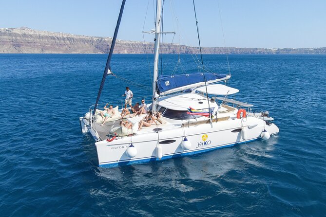 Full Day Santorini Catamaran Private Cruise With Meal and Transfer - Transport and Pickup