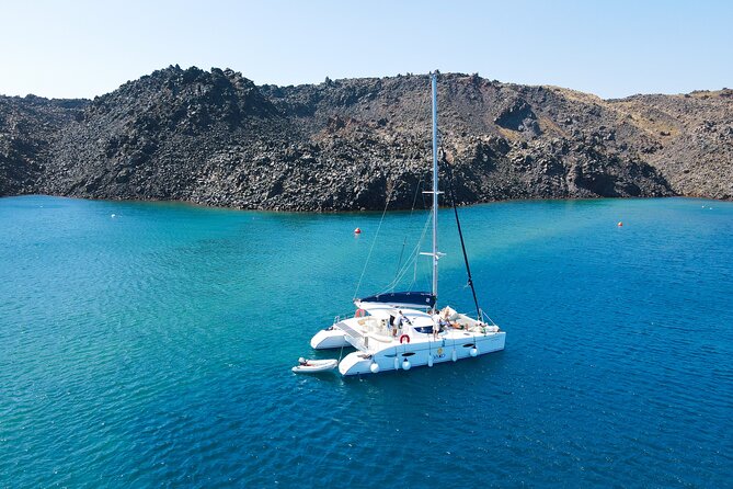 Full Day Santorini Catamaran Private Cruise With Meal and Transfer - Insurance and Amenities