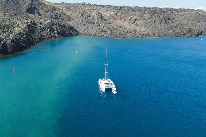Full Day Santorini Catamaran Private Cruise With Meal and Transfer - Pricing and Cancellations