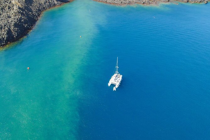 Full Day Santorini Catamaran Private Cruise With Meal and Transfer - About YAKO Sailing Santorini