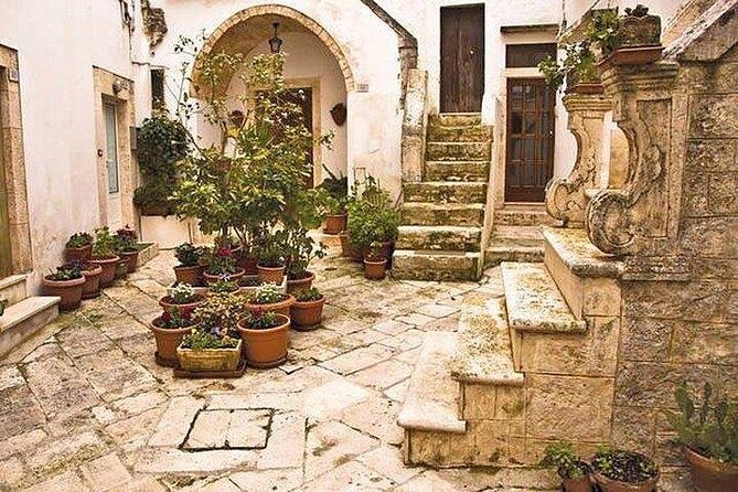 Full-Day Tour Alberobello & Locorotondo & Polignano a Mare & Bari - Discovering Polignano a Mare