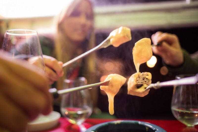 Geneva: Tour With Fondue and Wine in Tuktuk - Savoring Swiss Cuisine and Local Delicacies