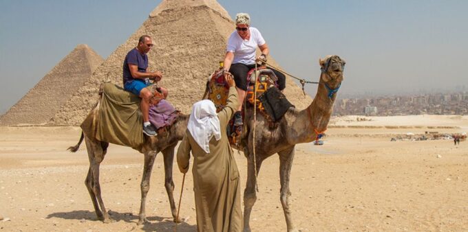 Giza: Pyramids at Sunset Guided Camel Tour - Cancellation and Flexibility