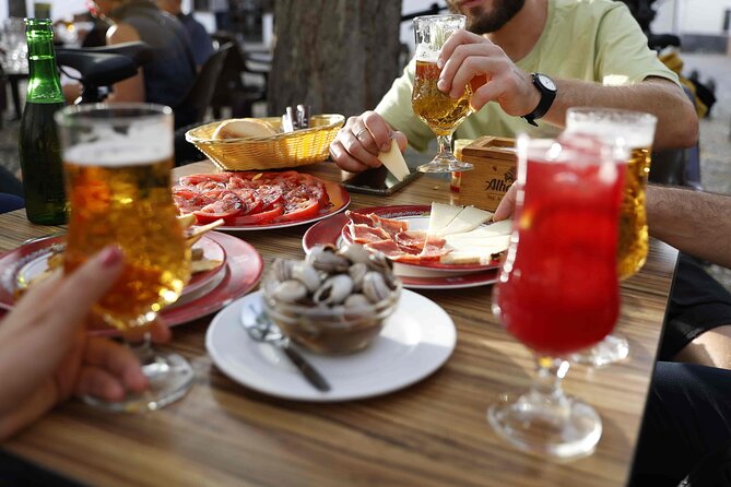Granada Highlights Tour With Tapas Breaks by Electric Bike - Savoring Tapas Breaks