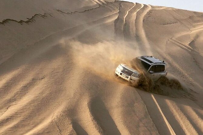 Half Day Desert Safari and Inland Sea With Sand Boarding - Pristine Beach Visit