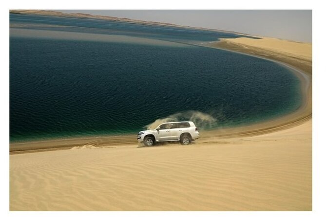 Half Day Desert Safari, Dune Bashing, Inland Sea & Sand Boarding - Sand Boarding Thrills